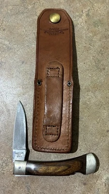 Navaja de bolsillo vintage CAMILLUS 885 con mango de madera inoxidable con cierre trasero con funda EE. UU. Foto 1 de 4