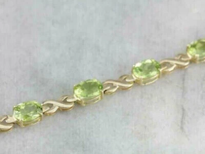 Brazalete de tenis de lujo de peridoto creado en laboratorio ovalado de 6,20 quilates enchapado en oro amarillo de 14 quilates Foto 1 de 4