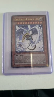 Yugioh Karte: Geflügelter Kuriboh LV 10 (CRV-EN005) - Ultra Rare, 1. Auflage  - Bild 1 von 2
