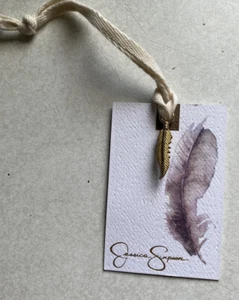 Jessica Simpson 1” Gold Tone Feather Charm On Card - Picture 1 of 6