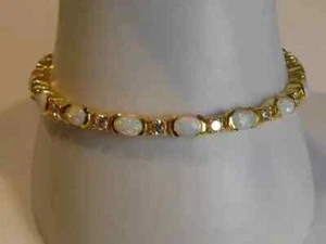 10Ct Oval Cut Lab Created Fire Opal Women Tennis Bracelet 14k Yellow Gold Finish - Picture 1 of 6