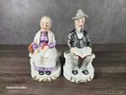 Set of 2 Handpainted Porcelain old man and woman figurines sitting on benches