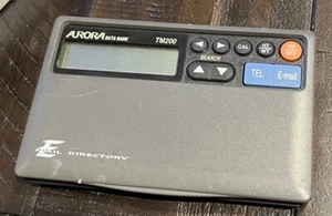 Banque de données Aurora TM200 organisateur, calculatrice et horloge d'annuaire de téléphone - Photo 1 sur 3