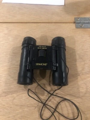 Simmons 10x 25 Binoculars Model 1159 With Case has rip Field 288 ft At 1000 yds - Image 1 of 4
