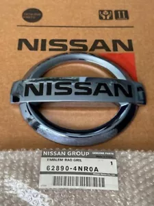 NEW OEM NISSAN Leaf 2011-2017 Ice Blue FRONT GRILLE EMBLEM 62890-4NR0A - Picture 1 of 8