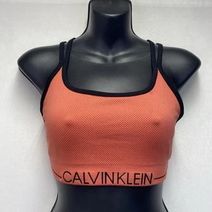 Sujetador deportivo CALVIN KLEIN Performance sin costuras acanalado cuello redondo para mujer coral medio - Imagen 1 de 12