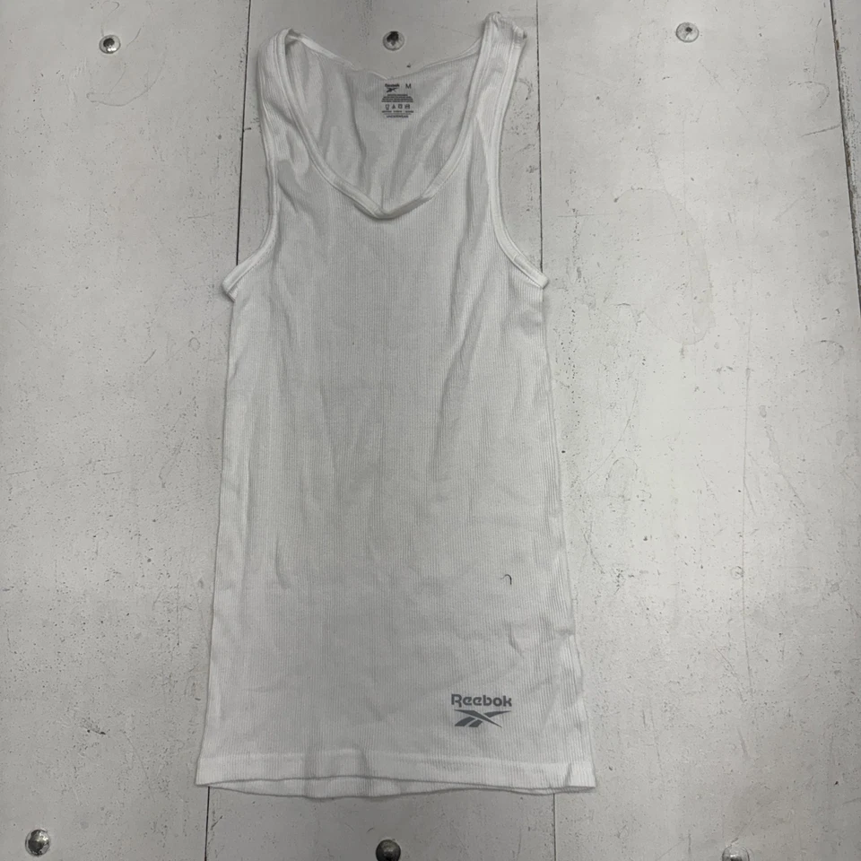 Paquete de 3 camisetas sin mangas Reebok blancas lisas acanaladas para hombre talla mediana Foto 1 de 4