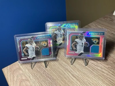 2021 Prizm Premier Jersey Travis Etienne Jr. Lot  of 3! (Green, Pink, Purple) - Image 1 of 2