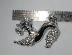 Vintage Gerry's Silver Tone Poodle Dog Brooch Blue Rhinestone Eyes Spaghetti - Picture 1 of 4