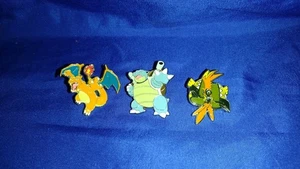 (3) POKEMON LIZENZIERTE EMAILLE PINS LOT BLASTOISE CHARIZARD TAPU KOKO **NEU** - Bild 1 von 2