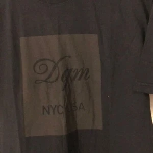 DQM Tee Shirt Size Large. NWOT Black - Picture 1 of 5