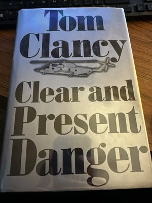 Signed Tom Clancy Clear and Present Danger Hardcover - Image 1 of 4