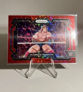 2024 Panini Prizm WWE - [Base] - RedUnder Card Prizm#11 - Ultimate Warrior /99 - Bild 1 von 3