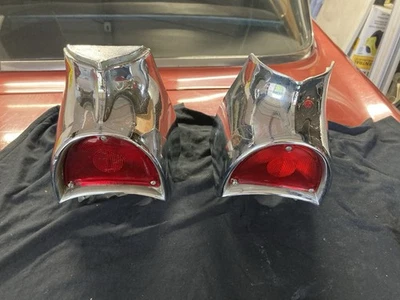 Original Pair 1957 Chevrolet Bel Air Chrome Taillight Housings - Image 1 of 4