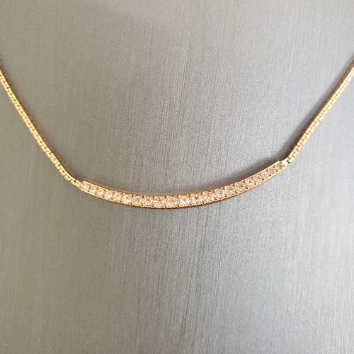 Collana barra curva tono oro rosa Michael Kors con accenti di cristallo firmata