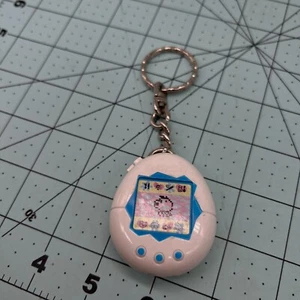 White Tamagotchi with red figure on key chain McDonald's toy 1997 Vintage - Picture 1 of 7