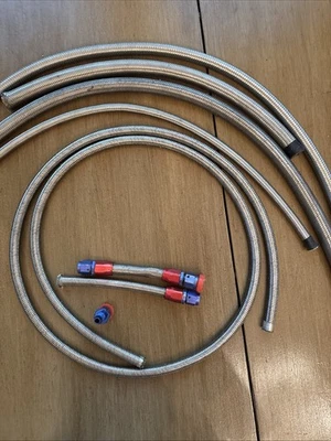 An Assortment Of Stainless Steel Braided Tubing AN Connectors - Image 1 of 4