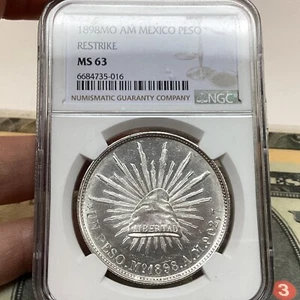 Mexico 1898 MO AM Peso Restrike NGC Ms63 - Picture 1 of 3