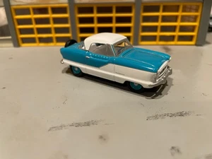 1/64 J.L.. NASH METROPOLITAN COUPE/AQUA-WHITE/WHITE INT/4 CYL./RUBBER TIRES - Picture 1 of 2