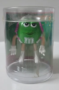 Personaje corporal flexible verde M&M con manguitos de oreja rosa de Toysite 2004 - Imagen 1 de 7