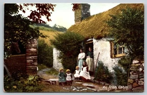 An Irish Cabin Postcard 1910s Family Outside Home Thatched Roof - Picture 1 of 3