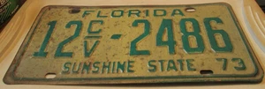 VINTAGE 1973 US FLORIDA NUMMERNSCHILD 12 C/V 2486 WEITERE SCHILDER HIER AUFGELISTET - Bild 1 von 2