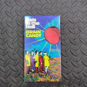 Caramelo cerebral Kids In The Hall VHS 1996 comedia oscura industria farmacéutica codicia - Imagen 1 de 7