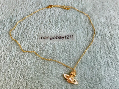 Vivienne Westwood Gold Crystal White Star Saturn Pendant Necklace - Image 1 of 4