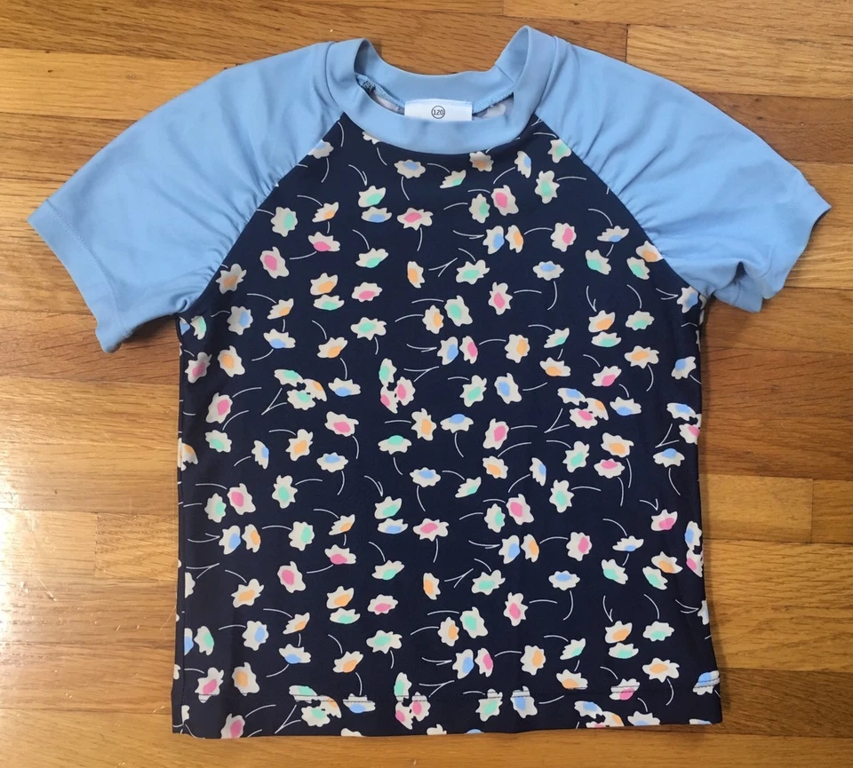 Camisa para niñas HANNA DIFFERENTSON protector contra erupciones, 120 flores azules Foto 1 de 4