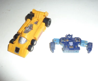 Coche de carreras amarillo Transformers 1985 G1 Stunticons Menasor tira de arrastre S-70 de colección Foto 1 de 4