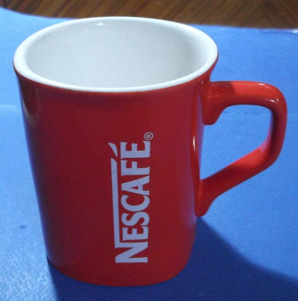 Taza/taza de café de cerámica Nestlé NESCAFE roja rara de colección 25... Foto 1 de 4