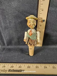 Tapón de botella con corcho de hombre saltador articulado arte popular tallado a mano - Imagen 1 de 2