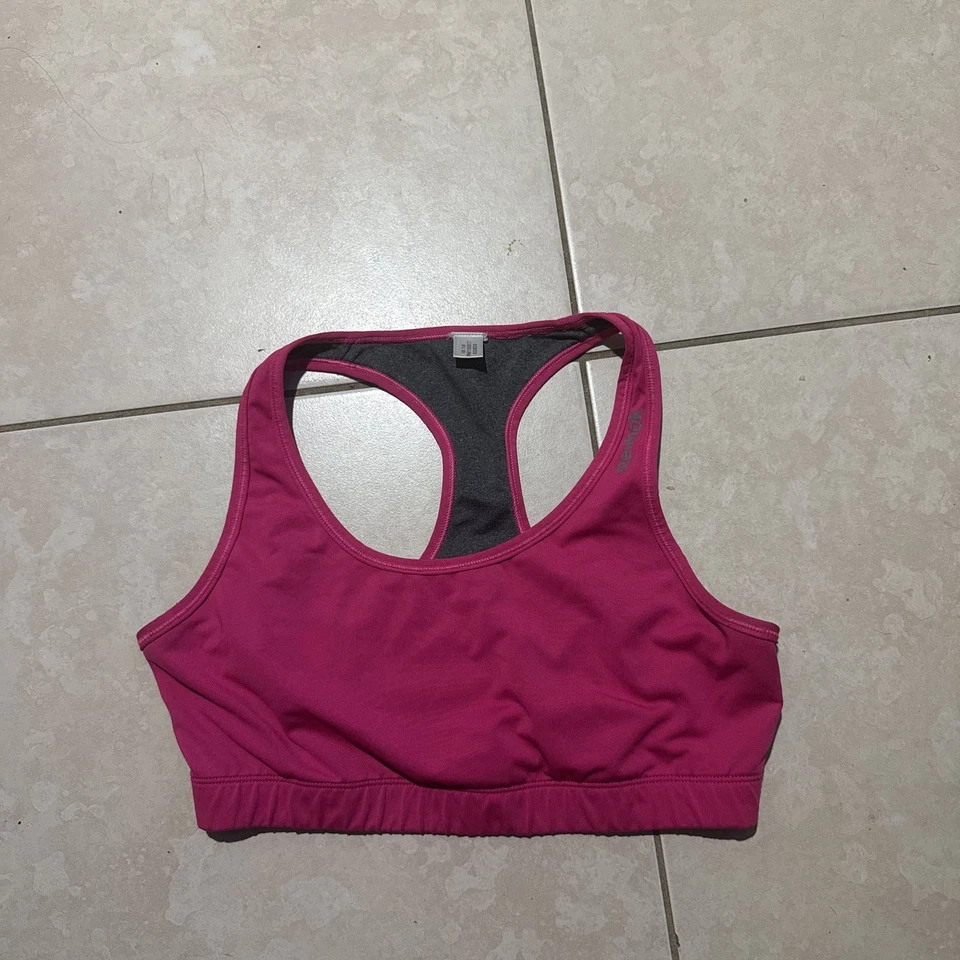 Sujetador deportivo Reebok Hot Pink Racerback, soporte medio Foto 1 de 4