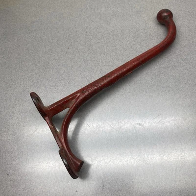 Antiguo gancho de pared rojo de hierro fundido Foto 1 de 4