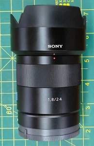 Mint Sony 24 mm Zeiss F1.8 E-mount Wide Angle Lens with UV filter, hood, and bag - Picture 1 of 12