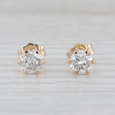 Aretes solitarios redondos de oro amarillo de 14 k de 0,98 quilates con diamantes Foto 1 de 4