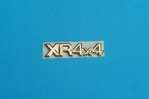 FORD " XR4x4 " SIERRA BADGE NEW, METAL GOLD PLATE, SELF ADHESIVE - Picture 1 of 3