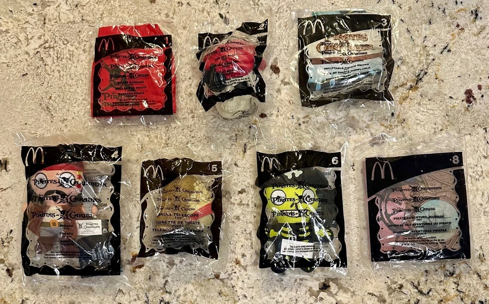 McDonald's 2006 Pirates of the Caribbean - Lot of Seven (1, 2, 3, 4, 5, 6, 8) - Image 1 of 2