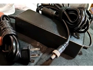12V 5A 60W AC DC power adapter. It converts AC power from a wall outlet to 12V.. - Picture 1 of 3