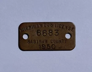 1950 Condado de Saginaw, Michigan, EE. UU. Licencia de etiqueta de impuesto de perro de latón - Imagen 1 de 2