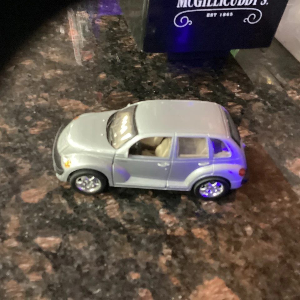 vtg 1/34 PULL BACK FRICTION SILVER PT CRUISER DOORS OPEN DIE CAST CAR CHRYSLER - Image 1 of 1