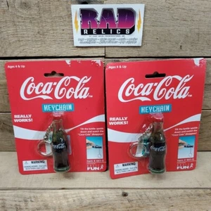 2 Vintage Coca Cola Bottle Collectible Keychain 1999 Coca Cola Disappear SEALED - Picture 1 of 5