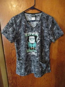 UNIVERSAL MONSTERS WOMENS SCRUB TOP SHIRT SIZE SMALL V-NECK POCKETS FRANKENSTEIN - Picture 1 of 6