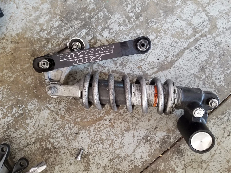 06-11 KAWASAKI NINJA ZX14 AMORTIGUADOR TRASERO RUGIENTE TOYZ ESLABONES DESCENSORES Foto 1 de 1