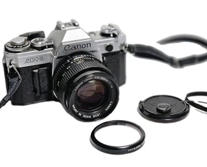 Canon AE-1 35mm SLR Camera with 50mm f/1:1.4 Lens w/New Battery, N. Mint. - Picture 1 of 21