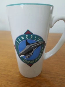 SeaWorld Parks Dolphin interaction Coffee Cup Mug is a colorful multicolored - Picture 1 of 9