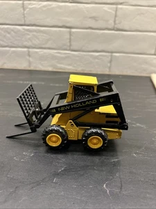 Sperry New Holland L-555 Super Boom Loader / Kompaktlader Maßstab 1:25 NZG Nr. 294 - Bild 1 von 12