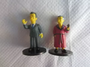 2013 WizKids/NECA Los Simpson: Tom Hanks y Hugh Hefner minifiguras - Imagen 1 de 2