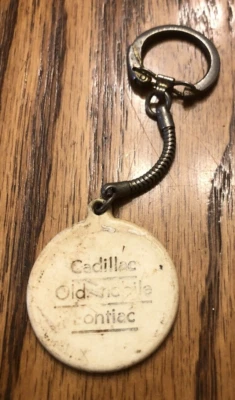 Vintage Cadillac Oldsmobile Pontiac dealership advertising keychain Ionia Mi. - Image 1 of 4