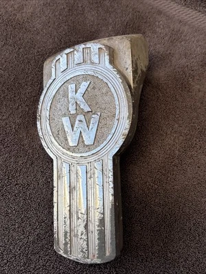 ** HEAVY WEAR **Kenworth Hood Ornament With Mount Bracket. - Image 1 of 4